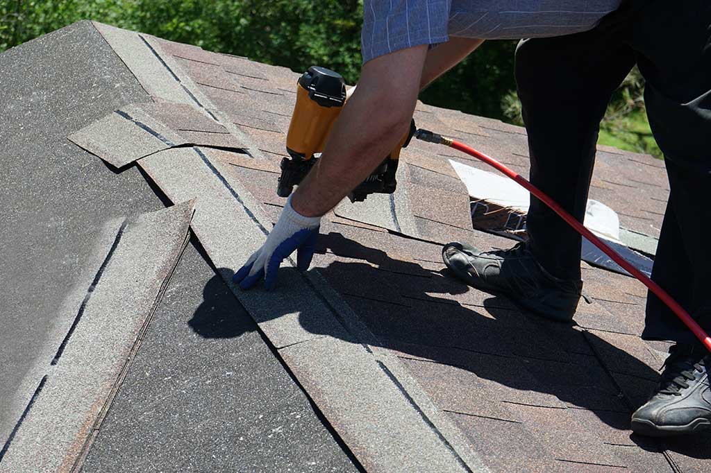 worker constructing a new roof